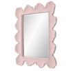 A beautiful wall mirror by Uttermost with a coral pink and organic shaped finish 