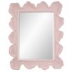 A beautiful wall mirror by Uttermost with a coral pink and organic shaped finish 