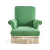 Green armchair with cream fringe bottom