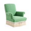 Green armchair with cream fringe bottom