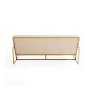 Upholstered beige sofa with brass detail