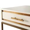 A stylish side table with a white high gloss varnish, a bamboo handle and finished with gold details