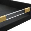 Sleek black shagreen textured tray with clear acrylic handles and brass accents