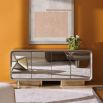 Elevate your space with the Aero Media Console from Caracole, featuring sleek design and ample storage for a stylish and functional entertainment solution.