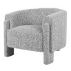 Curved grey armchair in boucle grey finish