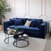 contemporary royal blue upholstered sofa with wide arms