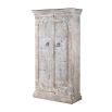 Ornately carved cabinet with washed wood finish