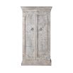 Ornately carved cabinet with washed wood finish