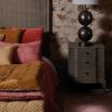 burnt orange leaf-print bedspread