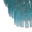 Elegant chandelier made up of layered blue glass tubes