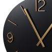 A luxurious minimal black and gold wall clock