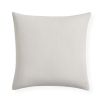 White cushion with orange sun detail