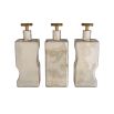 Organic shaped glass decanters with smoke luster finish and brass toppers
