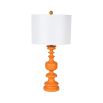 orange table lamp with curved base and white shade