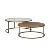 An exotic, elegant set of two rattan and glass coffee tables