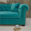 Luxury chic sofa with rolled studded arms and thick deep buttoned back