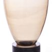 Warm toned glass vase with ribbed wooden base and three spherical feet