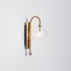 Natural solid brass industrial wall lamp with large handblown glass globe