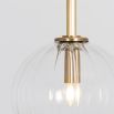Textured clear glass globe pendant ceiling light with natural brass fixture