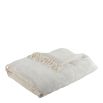 White futon with cotton and velvet and tassels on each side
