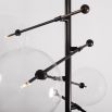 Black gunmetal retro style ceiling light with a 12 arm fixture and 12 clear glass globe design