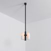 Contemporary retro style pendant ceiling light in a black gunmetal brass finish with translucent glass lampshade design