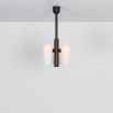 Contemporary retro style pendant ceiling light in a black gunmetal brass finish with translucent glass lampshade design