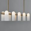 A luxurious linear chandelier by Schwung featuring translucent glass shades hung from a beautiful brass frame