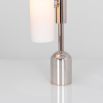 A dazzling polished nickel table lamp with triplex opal glass
