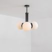 A chic, early century inspired LED pendant with translucent opal globes