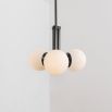 A chic, early century inspired LED pendant with translucent opal globes