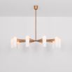 Glamorous retro chandelier with frosted glass lampshades and a solid, natural brass frame