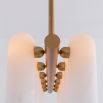 Contemporary natural brass finish chandelier with a colonnade of translucent glass lampshades 