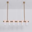 Contemporary natural brass finish chandelier with a colonnade of translucent glass lampshades 