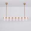 Contemporary natural brass finish chandelier with a colonnade of translucent glass lampshades