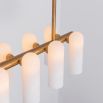 Contemporary natural brass finish chandelier with a colonnade of translucent glass lampshades