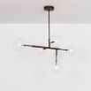 A chic and sophisticated black gunmetal LED pendant with transparent glass lampshades