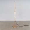 A glamorous industrial lacquered burnished brass floor lamp