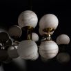 Extravagant marble and brass chandelier with orb-shaped shades