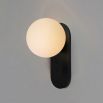 Enchanting rounded wall lamp mounted on gunmetal plate