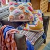 A striking cushion by Bloomingville with stylish tassels