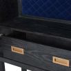 A luxurious wine cabinet created from black oak, brass details and luxurious royal blue velvet details