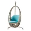 A luxury outdoor hanging swing chair from Willow's Outdoor collection with a beautiful bespoke upholstery 