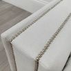 Boxy armchair with sumptuous grey mist upholstery and glamorous studding details 