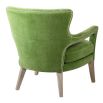 Green velvet upholstered armchair