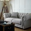 Luxury classic sofa with rolled arms with piping and thick deep buttoned back