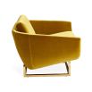 A luxurious golden-yellow velvet-upholstered lounge chair with a brushed brass base