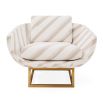 The Beaumont Lounge Chair combines minimalist design with luxurious comfort, featuring a sculptural brass base and elegant upholstery in velvet or bouclé.