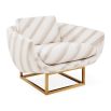 The Beaumont Lounge Chair combines minimalist design with luxurious comfort, featuring a sculptural brass base and elegant upholstery in velvet or bouclé.