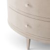 Charming, oval-shaped bedside table with two drawers and textured finish